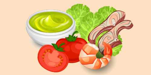 салат з креветками, рибою, помідорами, зеленим салатом і зеленим соусом